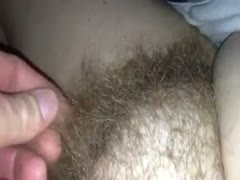 Facing a camera while rubbing my wife's curly, moist crack